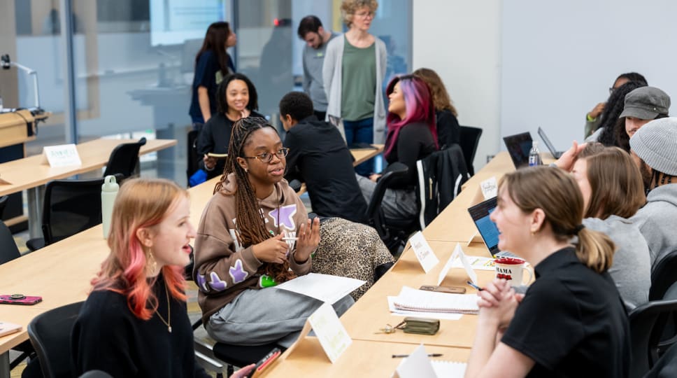 MD HIRES students and faculty practicing their “elevator pitches” about their research